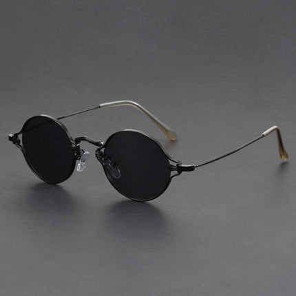 Anteojos de sol redondos, armazón metálico negro, estilo alternativo para jóvenes, lentes oscuros con protección UV.