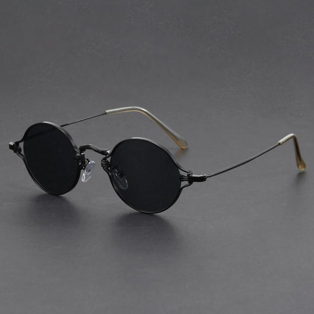 Anteojos de sol redondos, armazón metálico negro, estilo alternativo para jóvenes, lentes oscuros con protección UV.