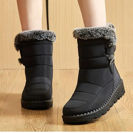 Bota Polar Trendy negra impermeable para mujeres, con interior de felpa y cierre de velcro, ideal para invierno.
