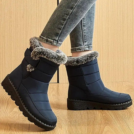 Bota impermeable azul con interior de felpa gris, suela antideslizante, ideal para mujeres durante el invierno.