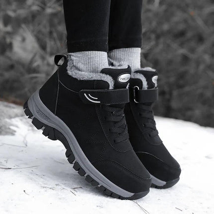 Botas de nieve antideslizantes impermeables negras para adultos con interior de lana, ideales para clima invernal.