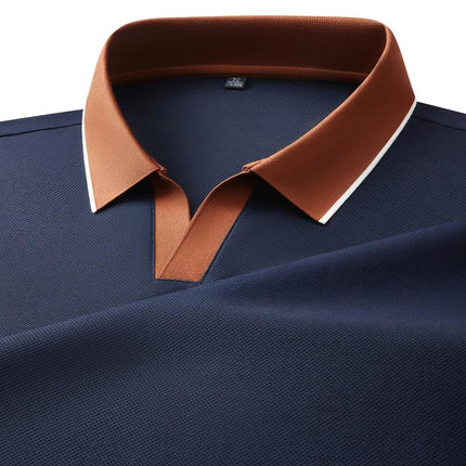 Chomba Odyssey azul marino con cuello marrón, tejido de punto suave para hombres, estilo elegante y cómodo ideal para oficina.