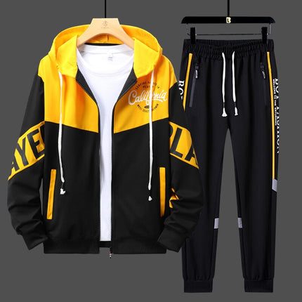 Conjunto deportivo urbano para hombre, buzo negro con capucha y detalles amarillos, pantalón con cintura elástica, ideal para entrenar.