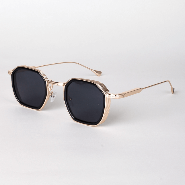 Gafas de sol Alain Delon para hombre, diseño angular con montura metálica y lentes oscuras UV400, estilo minimalista clásico.