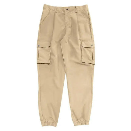 Pantalones deportivos beige para adultos, de algodón, tipo cargo, versátiles para uso casual y deportivo.