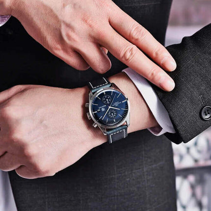 Reloj Benyar Elegance para hombre, esfera azul, correa cuero negro, diseño inspirado en la aviación clásica.