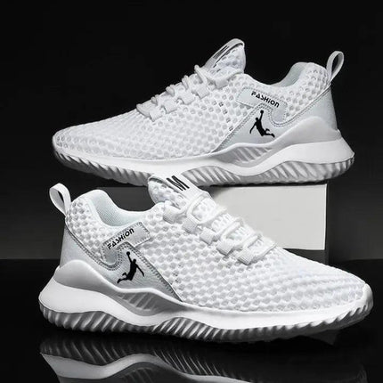 Zapatillas de correr blancas para hombre, ligeras y transpirables, ideales para actividad deportiva.