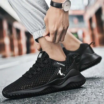 Zapatillas negras para correr, ligeras y transpirables, para hombre, con diseño moderno y urbano en material de malla.