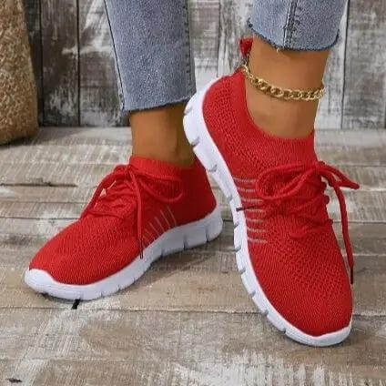 Zapatillas mujer rojas transpirables Zenithi, malla ventilada y suela flexible, ideales para rutina diaria. Público femenino.