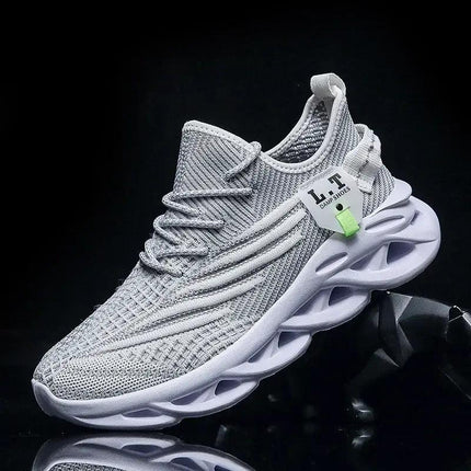 Zapatillas running hombre grises, ligeras y transpirables, con suela blanca, diseño moderno ideal para corredores en Argentina.