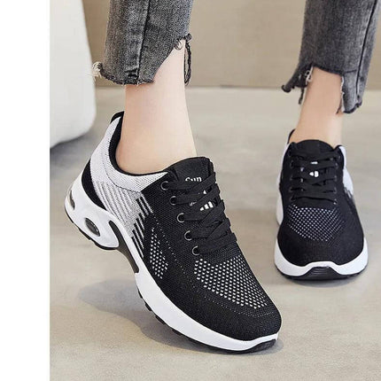 Zapatillas negras y blancas para correr, transpirables, suela ergonómica anti-impacto, unisex, diseño moderno.