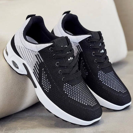 Zapatillas transpirables negras y blancas para correr, diseño ergonómico, suela anti-impacto, unisex.