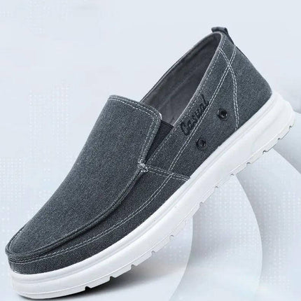 Zapatos de lona casuales grises para caminar, diseño moderno para hombre, suela blanca resistente.