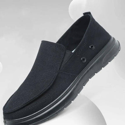 Zapatos de lona negra para hombres, ideales para caminar, diseño casual y cómodo con suela antideslizante.